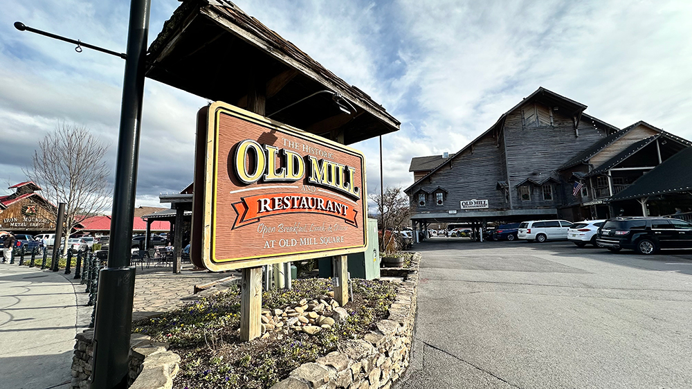 entrance to the old mill restaurant in sevierville tn with sign in view 