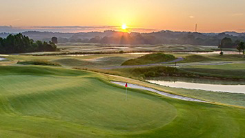 view of one of the holes at the sevierville golf club at sunrise