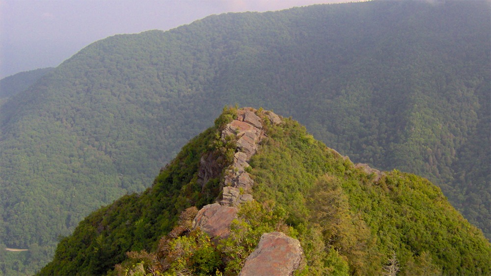 On of the summits on Chimney Tops Trail overlooking the mountains