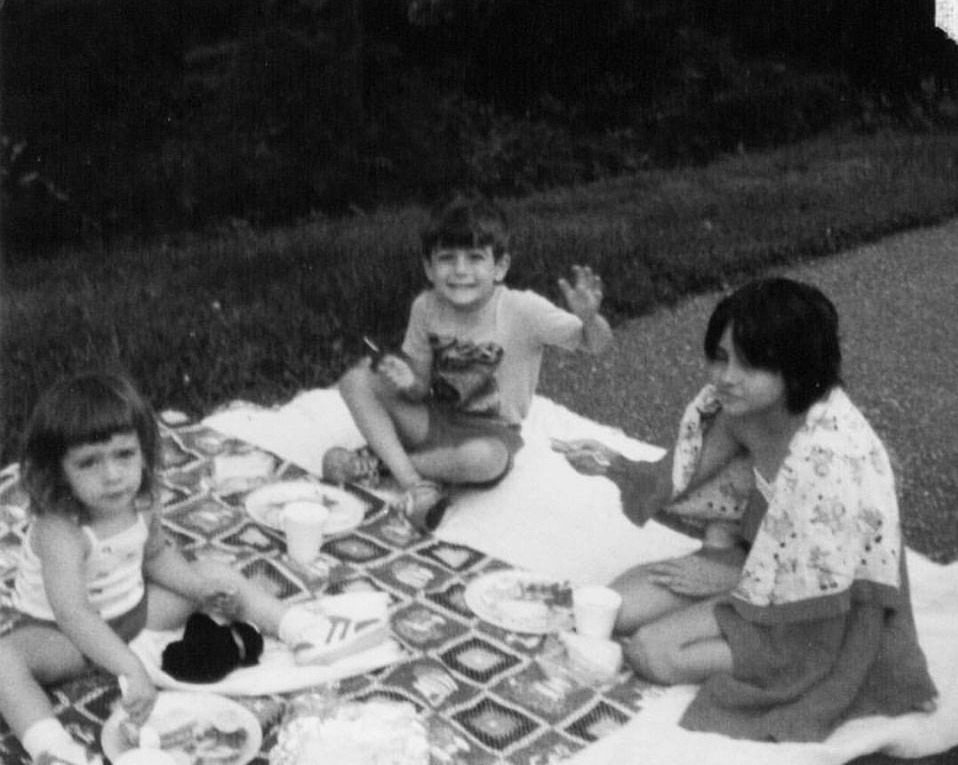 hapey cabin rentals owner as a child having a smoky mountains picnic with her brother and sister.