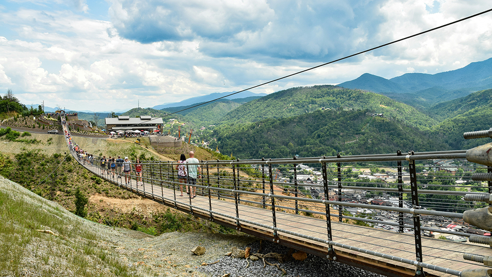 visitors crossing the gatlinburg skybridge