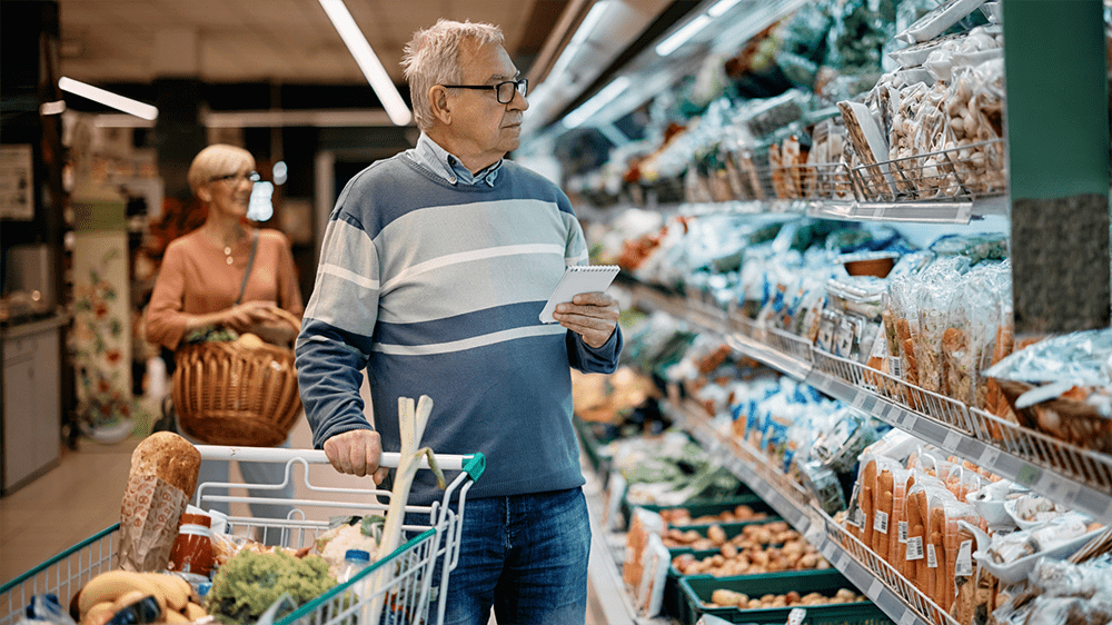 Tourist checking a grocery list while shopping at a grocery store in Gatlinburg, TN Tourist checking a grocery list while shopping at a grocery store in Gatlinburg, TN