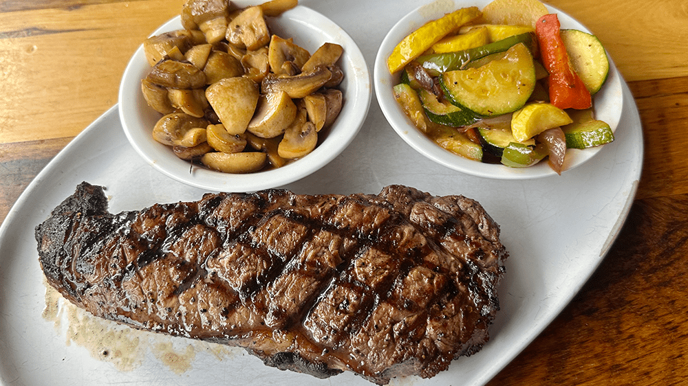 Grilled Strip Steak with sauteed vegetables and mushrooms from Howard's restaurant in Gatlinburg, TN