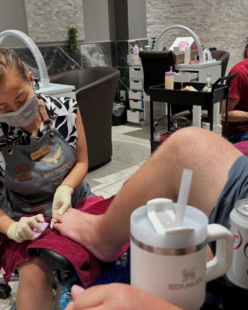 Male patron getting a pedicure at Noire Nail Bar in Sevierville, TN