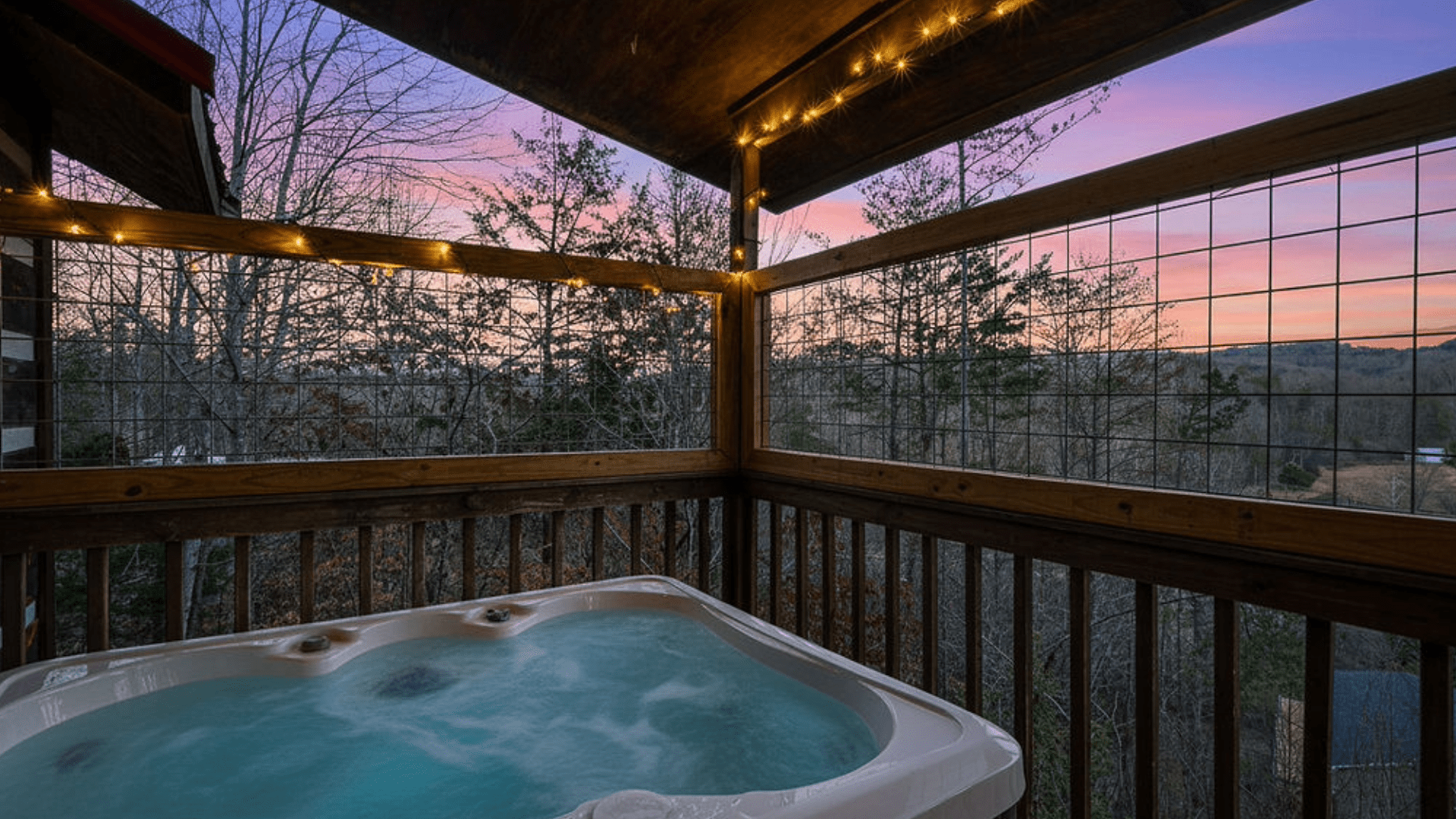 Private outdoor hot tub steaming on a cabin deck in the Smoky Mountains, illustrating the perfect, cool April evening ambiance and shoulder-season savings.