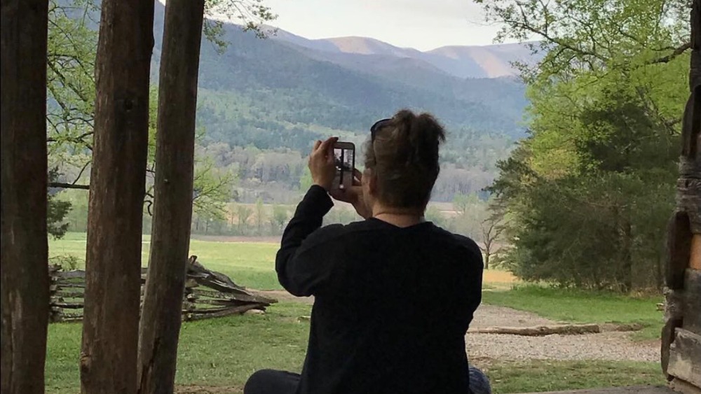 angie of hapey cabin rentals taking pictures of the smoky mountains
