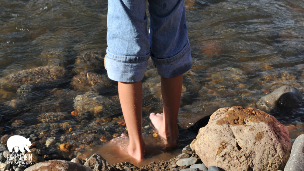 kid wading at The Sinks swimming hole along Little River Road in the Smokies