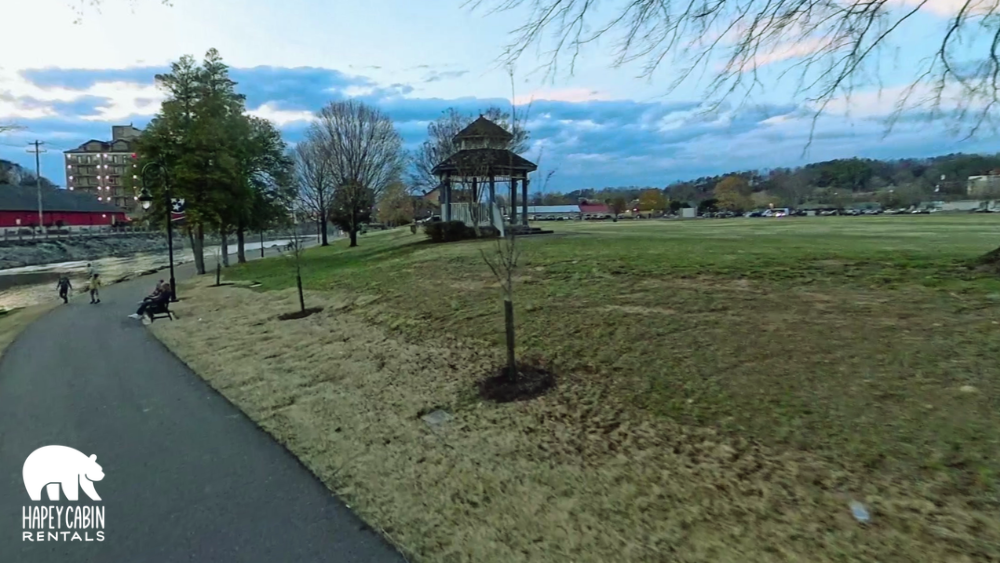 the flag-lined trail at Patriot Park in Pigeon Forge beside the Little Pigeon River