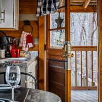 Alternate view of kitchen and open door at Hapey Memories
