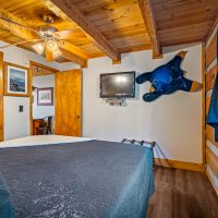 Bedroom two view of tv and window at Hapey Memories