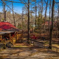 High angle image of Hapey Memories fenced side yard and parking