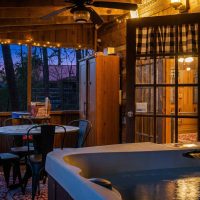 View of hot tub and view at dusk at Hapey Memories
