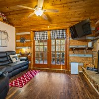 View of living room and fireplace at Hapey Memories