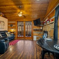 view of living room and door to back porch at Hapey Memories
