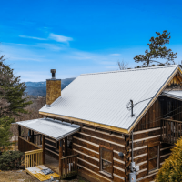 Exterior view of Little Bear cabin and view of mountains