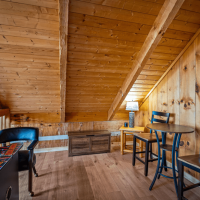 Little Bear loft area with arcade table