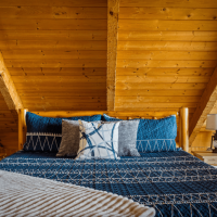 View of bed in loft at Little Bear Cabin