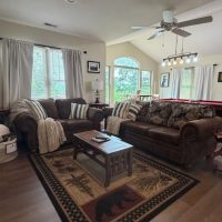 Living area with mountain views at sunny view cabin.