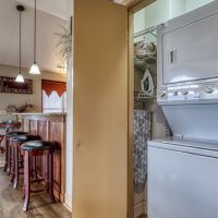 Kitchen area with bar counter seating at Sunny View Cabin cabin rental in Sevierville Tennessee