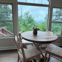 View of breakfast nook and mountain view at sunny view cabin.