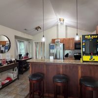 View of kitchen from pool table at sunny view cabin.
