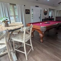 View of pool table and breakfast area at sunny view cabin.